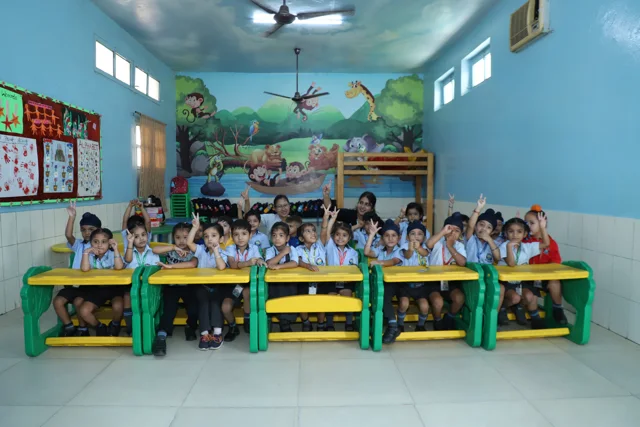 Children and their teacher in the kindergarten classroom