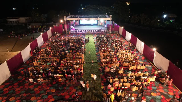 The illuminated stage and audience seen from above