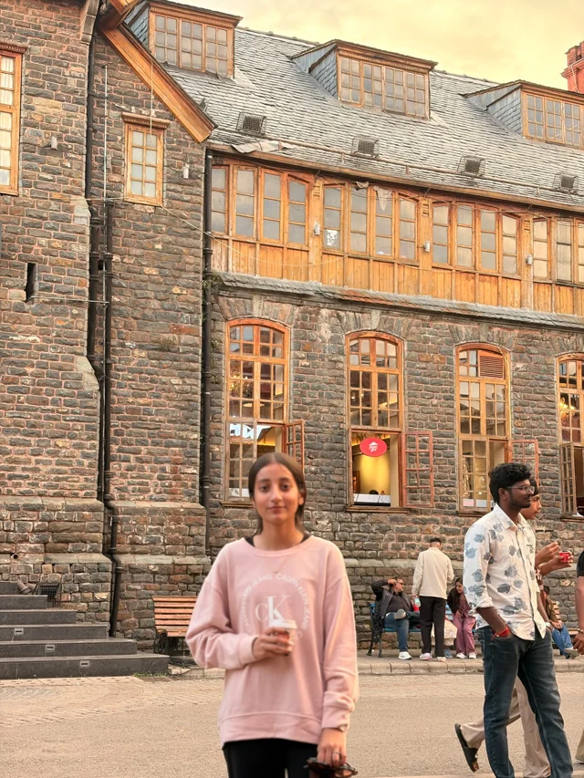 A photograph beside a historic building in Shimla