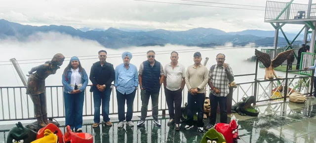The trip group against a mountain backdrop